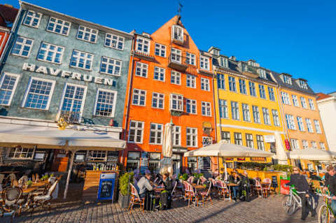 Experience Nyhavn Copenhagen’s iconic waterfront with colorful buildings, restaurants, cafés, and a lively atmosphere just a short walk from the apartment.