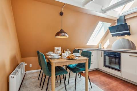 Modern Kitchen With Skylight and Dining Area