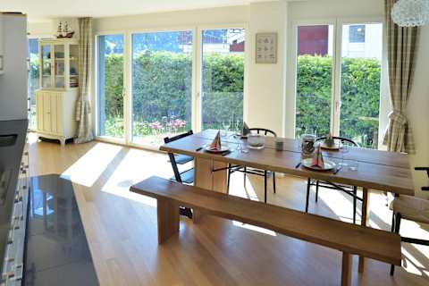 Enjoy memorable meals with family and friends in the light-filled dining area overlooking the surrounding alpine scenery.