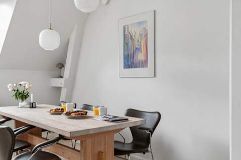 Spacious dining area perfect for shared meals, work, or relaxing evenings. Pure Hygge!