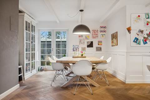 A cozy dining area filled with natural light — the perfect place for long dinners, shared stories and slow, memorable moments together.