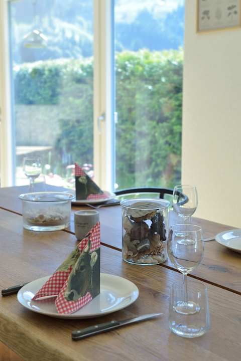Enjoy memorable meals with family and friends in the light-filled dining area overlooking the surrounding alpine scenery.