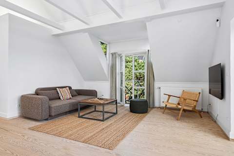 With panoramic sea views from the first floor, this inviting living room is a place you'll never want to leave. Light the fireplace on cooler evenings, enjoy a movie together, or simply relax as the sea quietly becomes part of the view.