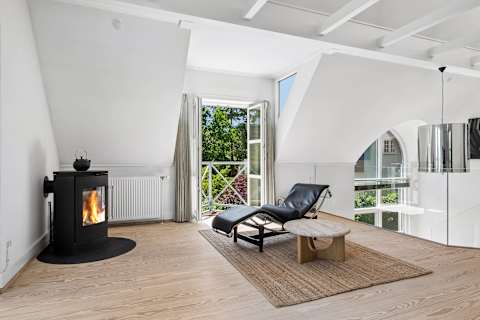 With panoramic sea views from the first floor, this inviting living room is a place you'll never want to leave. Light the fireplace on cooler evenings, enjoy a movie together, or simply relax as the sea quietly becomes part of the view.