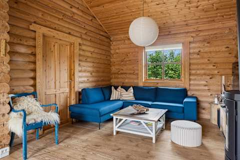 🛋️ Living Room
Cozy Moments Together
Sink into the sofa, light the wood-burning stove, and enjoy slow evenings filled with warmth, laughter, and good company.