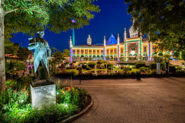Just a short walk away — experience the magic of Tivoli Gardens, especially as it lights up in the evening.