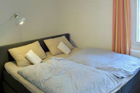 Bright and peaceful bedroom designed for a restful night's sleep after a day of exploring Engel