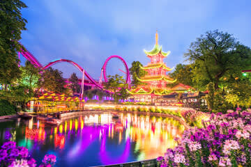 Just a short walk away — experience the magic of Tivoli Gardens, especially as it lights up in the evening.