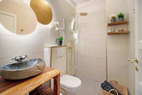 Contemporary full bathroom with a modern walk-in shower and elegant finishes. Designed with comfort and quality in mind, offering a refined, hotel-like experience