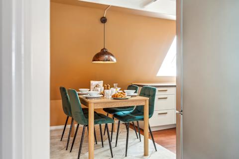 Modern Kitchen With Skylight and Dining Area