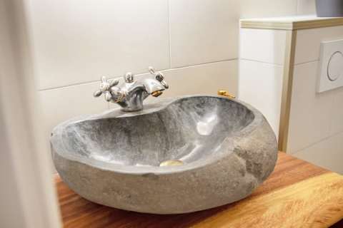 Contemporary full bathroom with a modern walk-in shower and elegant finishes. Designed with comfort and quality in mind, offering a refined, hotel-like experience