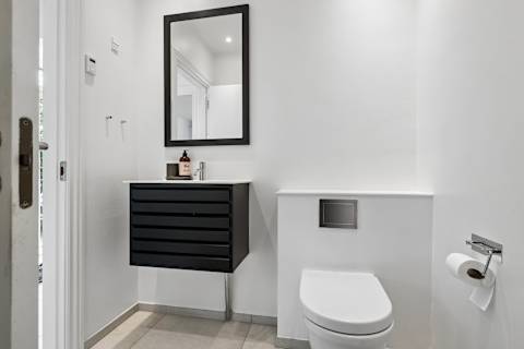 Bathroom 1 Ground Floor:
Start your morning with a refreshing shower or unwind after the beach in this beautifully designed bathroom with elegant Scandinavian finishes.