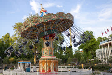 Just a short walk away — experience the magic of Tivoli Gardens, especially as it lights up in the evening.
