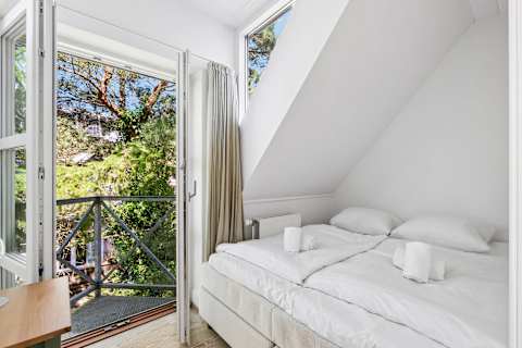 Bedroom 2 VIP
A bright bedroom with direct access to a private terrace. Open the doors, listen to the birds, and start your day with the peaceful atmosphere of the Danish coast.