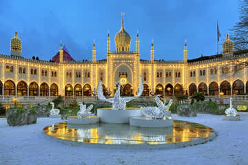 Just a short walk away — experience the magic of Tivoli Gardens, especially as it lights up in the evening.