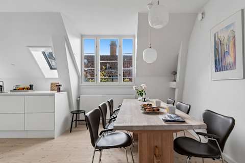 Spacious dining area perfect for shared meals, work, or relaxing evenings. Pure Hygge!
