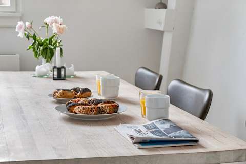 Spacious dining area perfect for shared meals, work, or relaxing evenings. Pure Hygge!