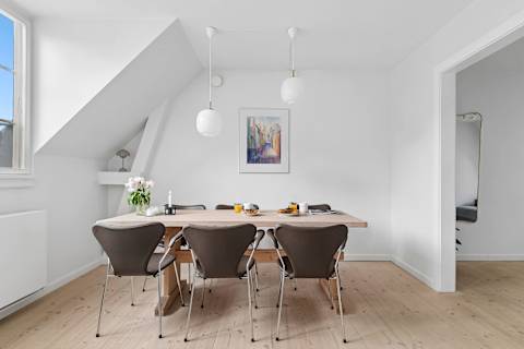Spacious dining area perfect for shared meals, work, or relaxing evenings. Pure Hygge!