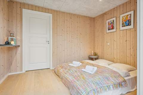 A cozy and private bedroom in the garden annex — a warm, inviting space offering comfort, calm and a sense of retreat.