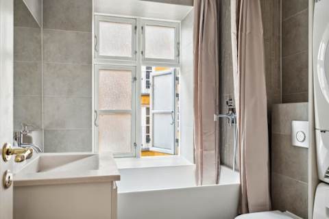 Elegant bathroom with generous bathtub ideal for long relaxing baths