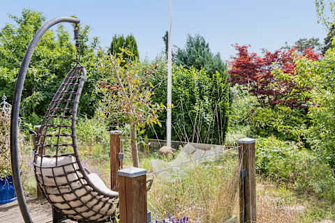 Unwind in the hanging chair, and enjoy the peaceful garden surroundings