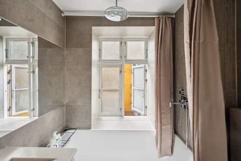 Elegant bathroom with generous bathtub ideal for long relaxing baths