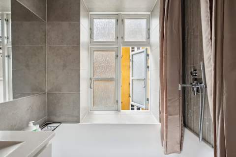 Elegant bathroom with generous bathtub ideal for long relaxing baths