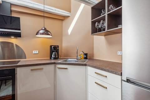 Modern Kitchen With Skylight and Dining Area