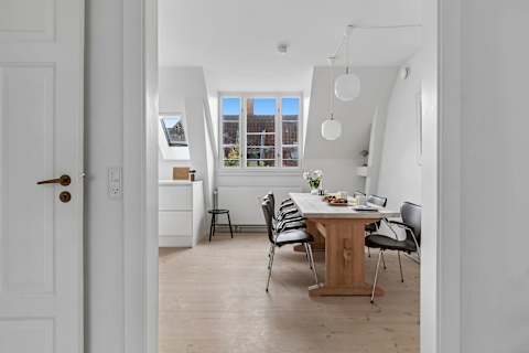 Spacious dining area perfect for shared meals, work, or relaxing evenings. Pure Hygge!