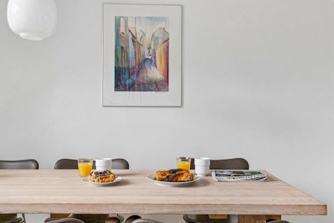 Spacious dining area perfect for shared meals, work, or relaxing evenings. Pure Hygge!