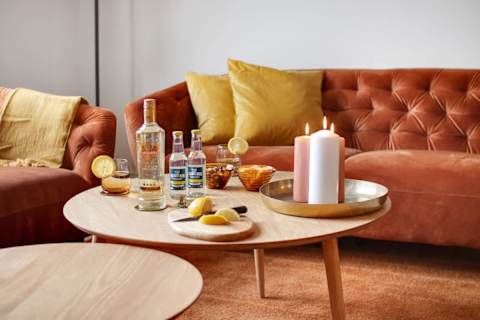 Beautiful, spacious living area with a sophisticated atmosphere and plenty of natural light. Enjoy a large flat-screen TV, comfortable seating, and a dining table perfect for relaxed dinners and social evenings.