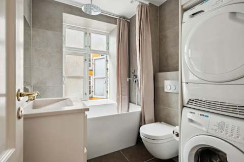 Elegant bathroom with generous bathtub ideal for long relaxing baths