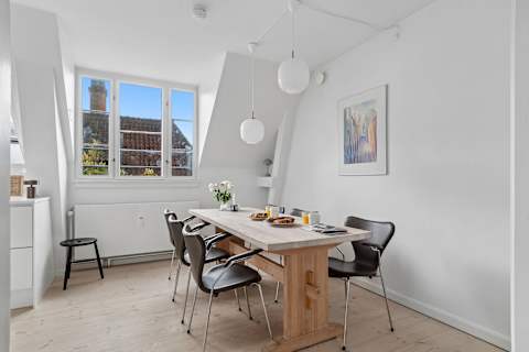 Spacious dining area perfect for shared meals, work, or relaxing evenings. Pure Hygge!