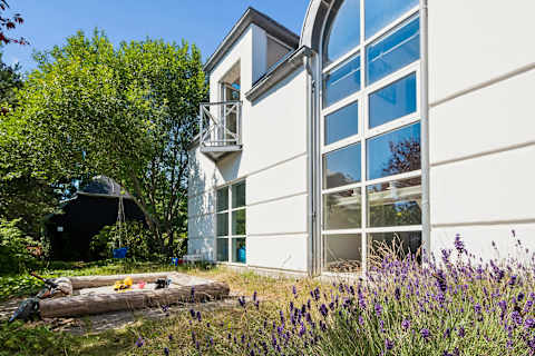 An authentic wooden sandbox where little adventures begin, giving children their own magical space while the adults unwind in the beautiful garden.