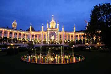 Just a short walk away — experience the magic of Tivoli Gardens, especially as it lights up in the evening.