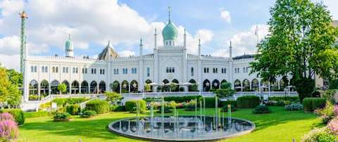 Just a short walk away — experience the magic of Tivoli Gardens, especially as it lights up in the evening.