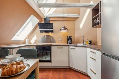Modern Kitchen With Skylight and Dining Area